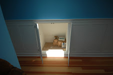 Wainscot hides storage in roof line.