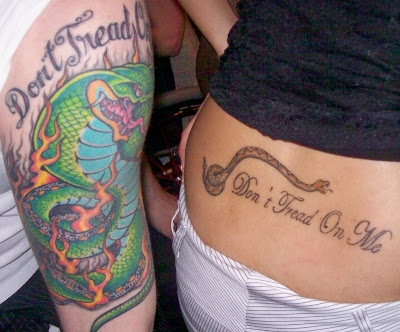 Josiah's arm tattoo next to Ileana's back tattoo. Is that freaking cool, 