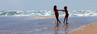 Children dancing on Moliets beach