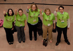 The West Virginia team flashes the peace sign.