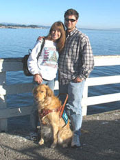 photo of me, with Sophie's attention on the sea lions who were barking on the rocks below the pier