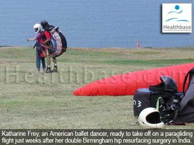 Katharine Frey taking off on a paragliding flight just weeks after her Birmingham hip resurfacing surgery in India