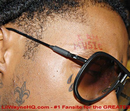The prayer on Lil Wayne's back You can clearly see his'I Am Music' and his