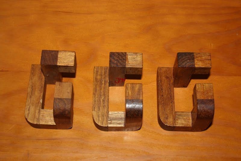 puzzles de ingenio de madera y soluciones