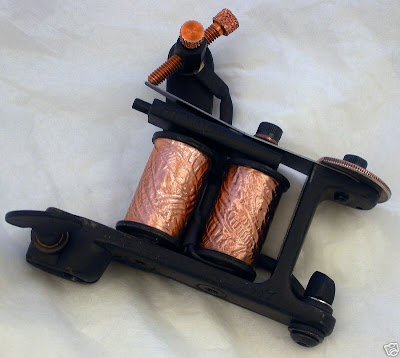 this tattoo machine(2007) is built by Aaron Cain ( www.aaroncain.com )