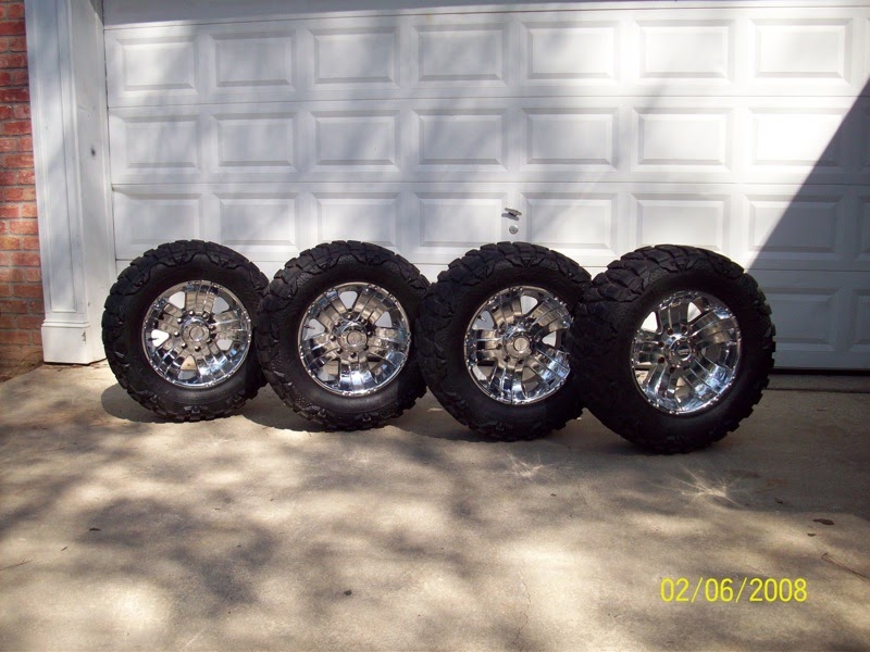 Rims and tires 33 inch Mud grapplers on 18 inch wolverines