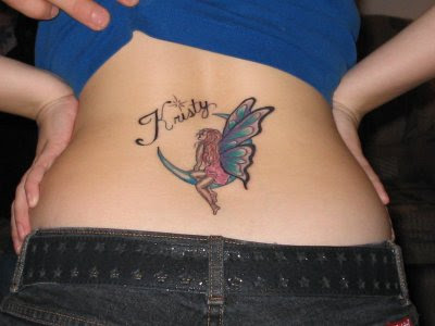 Notes and star tattoo on lower back.