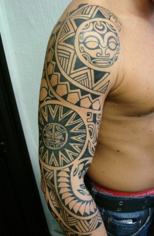 biomechanical and Samoan negative tribal upper arm tattoo