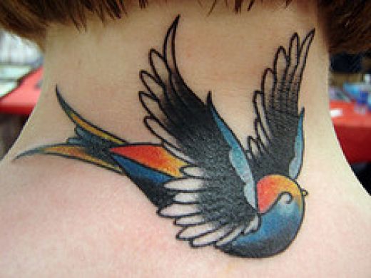 bird tattoo on back of neck