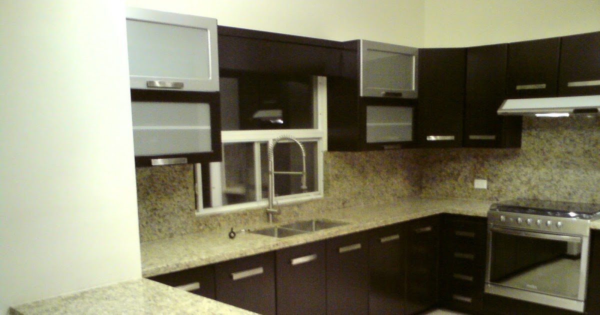 JC COCINAS Y CLOSETS: Cocina Chocolate con cubierta de granito Santa
