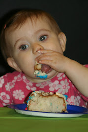 Brylie enjoying her first birthday cake.