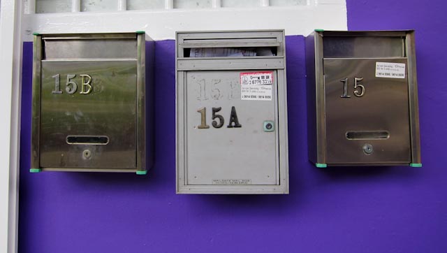 3 letter boxes on a purple letter boxes. 3 letter boxes on a purple