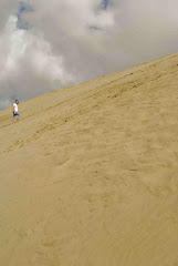 Hiking up the sand dunes at 90 mile beach