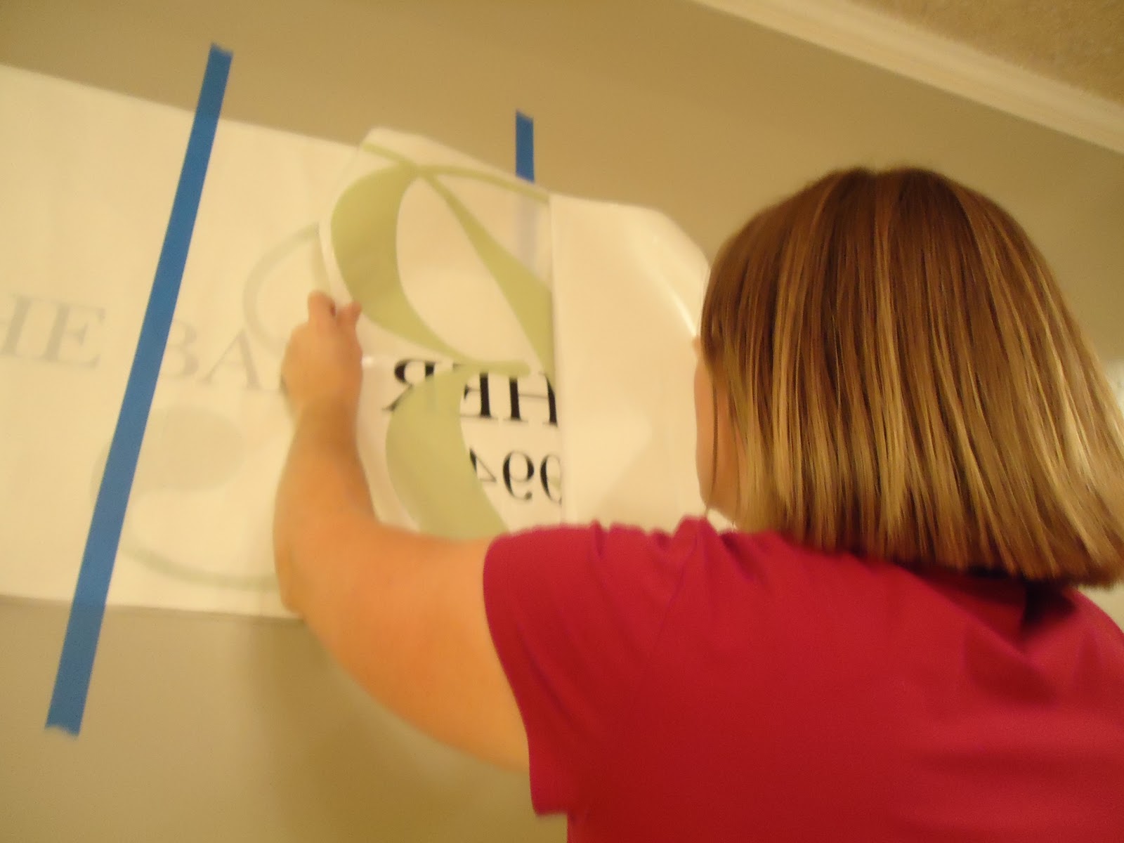 That bare wall in the kitchen how to hang a large decal! Organizing
