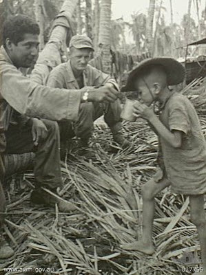 Philippines People Filipino Pinoy Pilipinas Old Black White Pictures evacuation leyte world war II WWII soldiers boy drinking noon