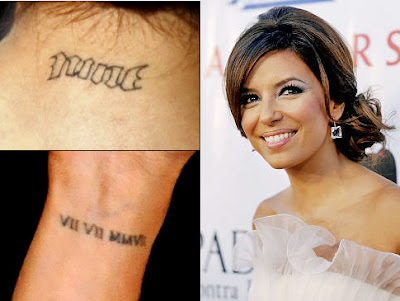 It is positioned next to her elbow, near another tattoo of the roman numeral