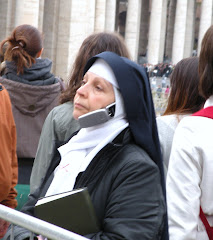 Pious nun gazes at St Peter’s Basilica