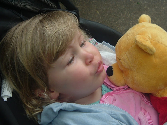 Gracie kisses Pooh Bear
