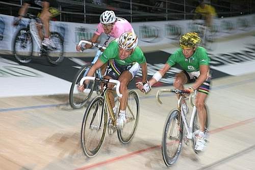 Italy's Olympic champion Paolo Bettini, left, looks at his