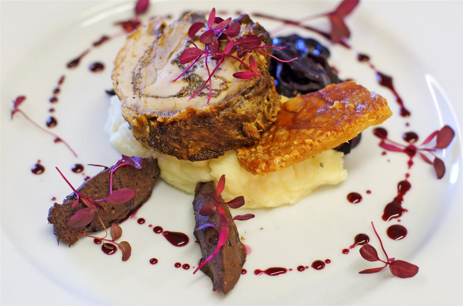 Mise en place Confit of Belly pork with mash, braised cabbage