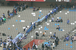 Suwon fans take their banners home