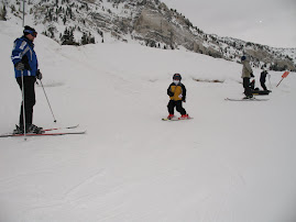 Gavin skiing towards Dad
