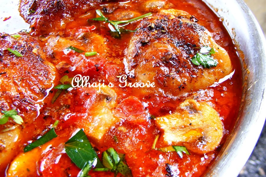 Food and lens Stewed chicken in tomato, mushroom and cheese sauce.