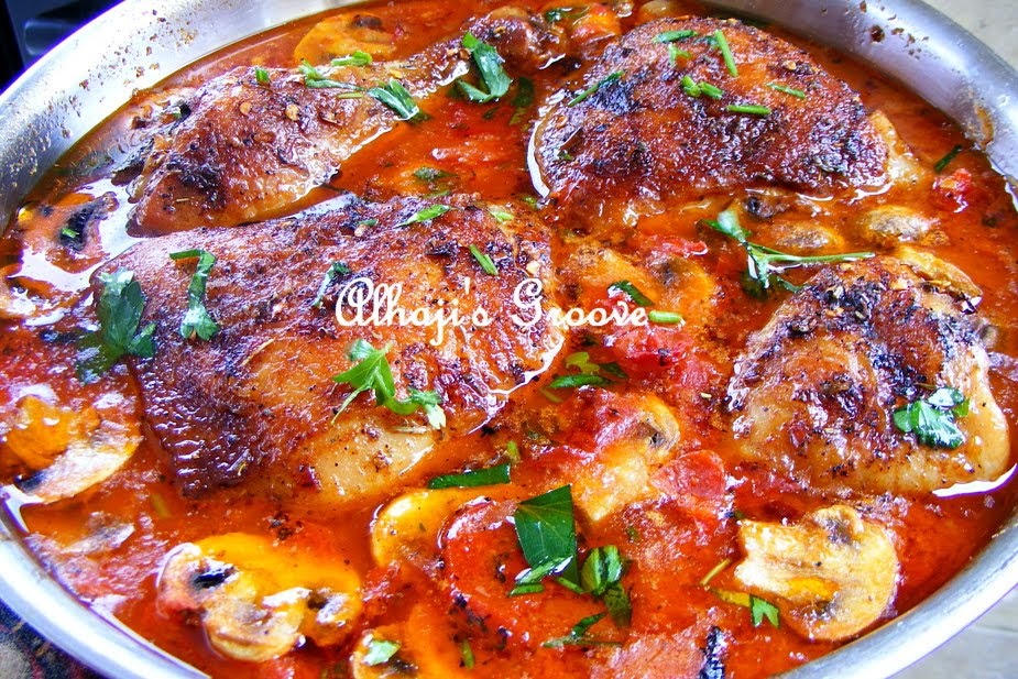 Food and lens Stewed chicken in tomato, mushroom and cheese sauce.