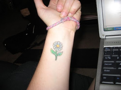 Enjoy these pictures of lovely Daisy tattoo artwork
