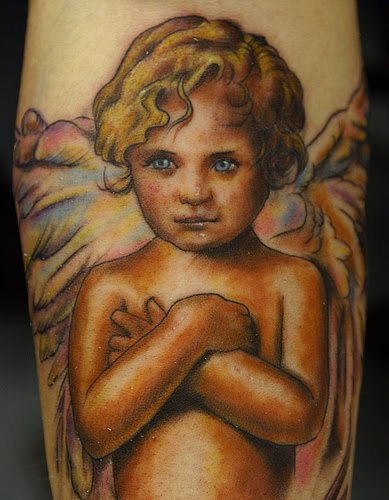 Colorful cherub tattoo