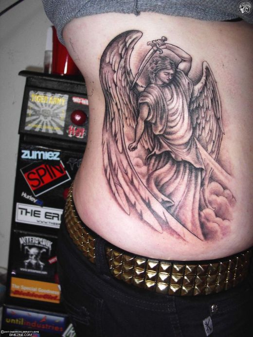 Angel tattoo on side torso.