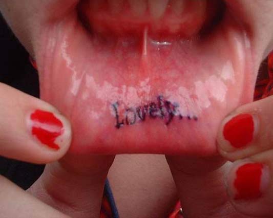 Lovely lip tattoo.