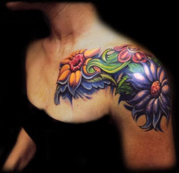 Yellow green and purple flowers shoulder tattoo.