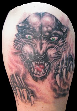 Panther and claws tattoo.