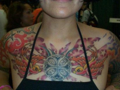 tattoos of stars on chest. Birds, cross and stars chest tattoo for women.