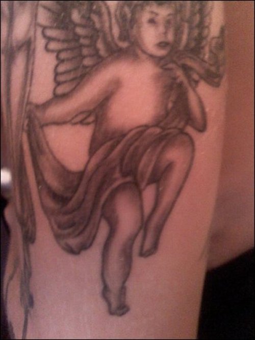 Cherub tattoos go hand in hand with other designs such as flowers, 
