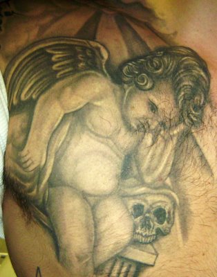 Angel Tattoos Colorful cherub tattoo. It is also very common for people to
