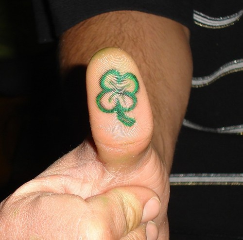 Four leaf clover tattoo on bottom of thumb idea.