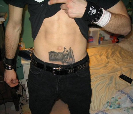 The guy's got more junk tattoos than an MS13 gana member.