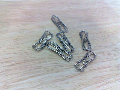 Entangled Paper Clips.