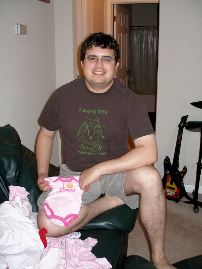 [Devon+folding+baby+clothes.JPG]