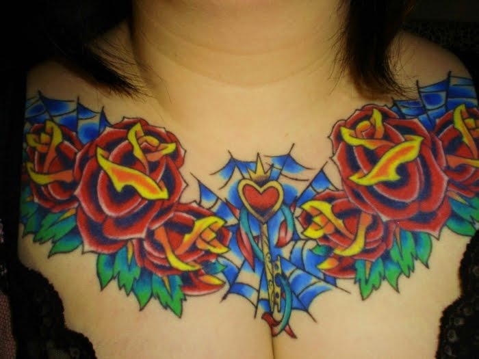 Large wing on chest with little red heart in the middle