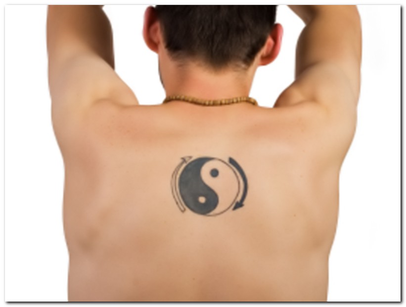 Tribal yin yang tattoo design on back left shoulder. Yin Yang Tattoos