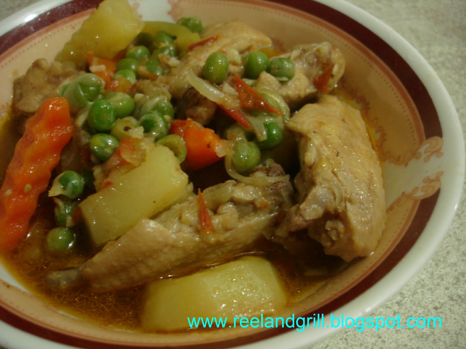 Reel and Grill Chicken Afritada in Fresh Tomatoes