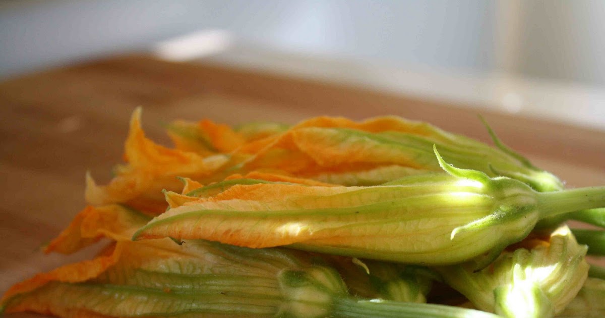 Apples and Butter Sausage and Goat Cheese Stuffed Squash Blossoms