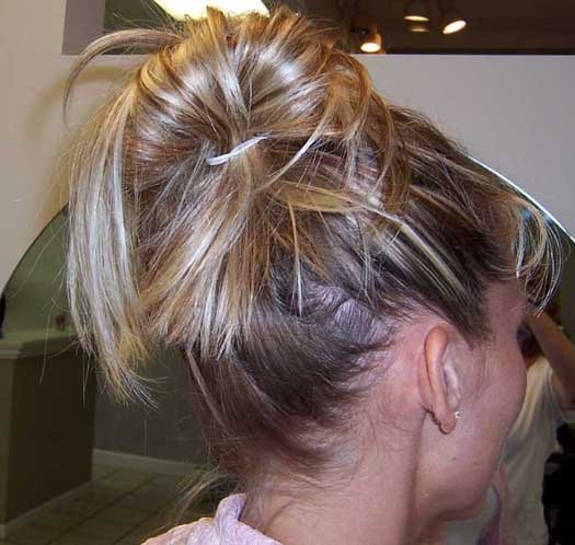 How To Create A Messy Bun With ELLE Magazine side swept messy bun hairstyles