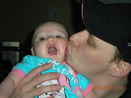 My Daddy smooches my cheeks.  04Apr09
