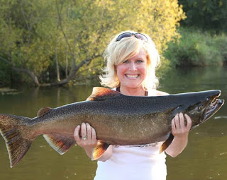 Sherri with a Huge Muskegon River Salmon. She got this on only her 4th cast on her first ever Salmon Fishing trip.