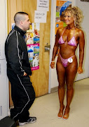 Mike is giving advice and showing support at the 2009 Saint John Muscle & Fitness Competition