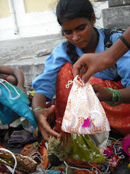Woman (and children) selling bags